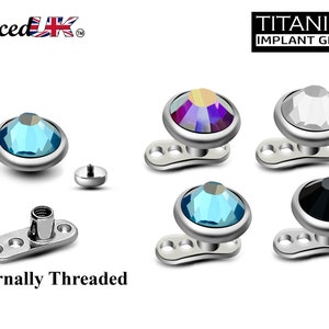 May include: Titanium implant grade internally threaded body jewelry with a variety of colored gem tops. The tops are available in blue, black, white, and iridescent. The jewelry is internally threaded and has a flat back.