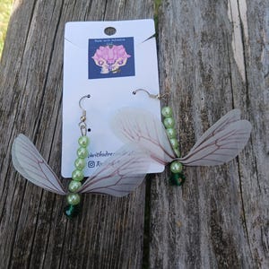 Whimsical dragonfly earrings with green pearls