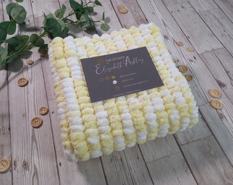 Handknit baby pom pom blanket in lemon/white mix