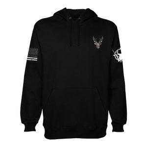 May include: Black hooded sweatshirt with a camouflage deer graphic on the front and a white American flag and a white hunting rifle graphic on the sleeves.