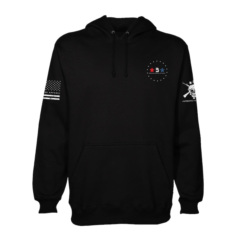 May include: Black hooded sweatshirt with a white American flag on the left sleeve, a white skull with crossed rifles on the right sleeve, and a red, white, and blue star logo on the chest. The logo says "American Made Apparel".