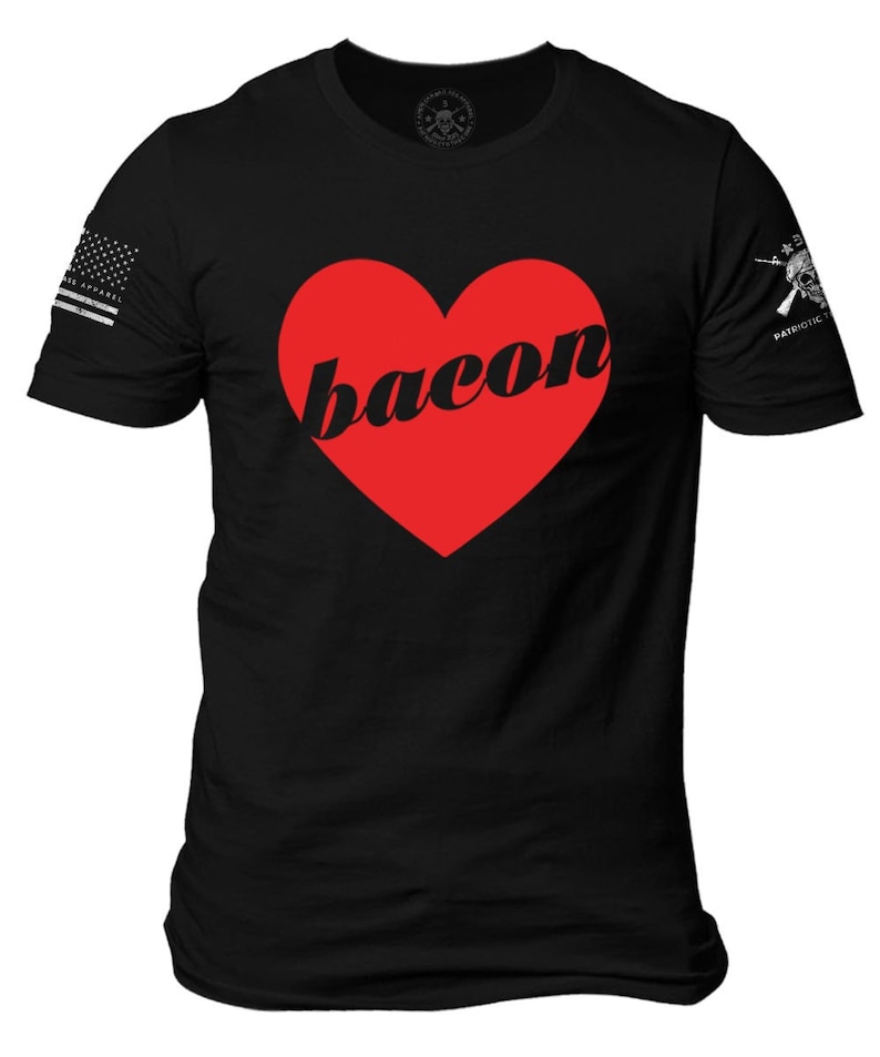 May include: Black t-shirt with a red heart that says "bacon" in a black font.