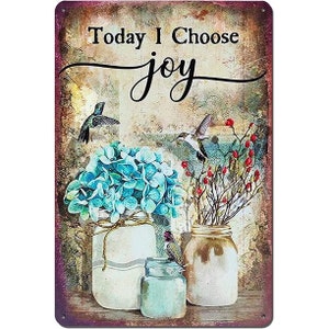 May include: A vintage-style metal sign with the text "Today I Choose joy" in black lettering. The sign features a floral arrangement of blue hydrangeas in two mason jars, with a hummingbird perched on a branch with red berries.