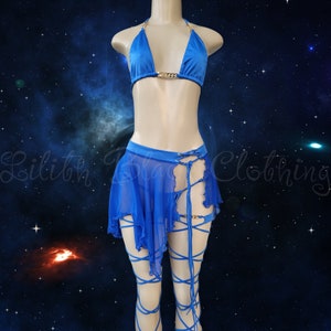 May include: A blue lingerie set with a halter top, a sheer skirt, and matching leg straps. The top has a gold chain detail and the skirt has a lace-up detail.