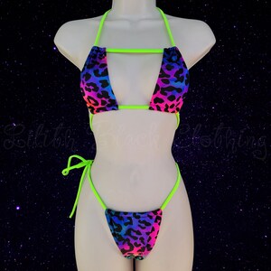 May include: A neon green and rainbow leopard print bikini with a halter top and a string bottom.