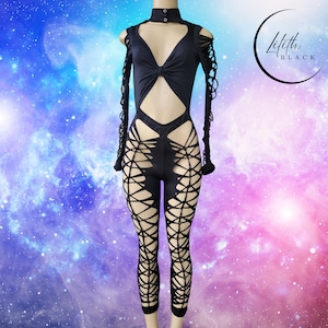 May include: Black bodysuit with cut-out and lace-up detailing. Features long sleeves with cut-out accents, a high neckline, and a keyhole design at the chest. The legs have a lattice design. The Lilith Black logo is in the upper right corner.