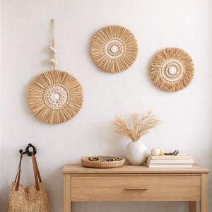 May include: A set of three ceramic nesting bowls in shades of blue, green, and white. The bowls have a speckled glaze and a simple, modern design. The largest bowl is about 15 cm in diameter.