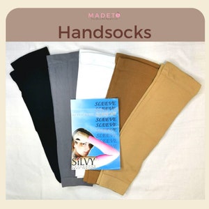 May include: Five pairs of arm warmers in black, gray, white, beige, and light brown. The arm warmers are made of a soft, stretchy fabric. The packaging includes the text "Sleeve Sleeve Sleeve Sleeve Sleeve Sleeve Sleeve Sleeve".