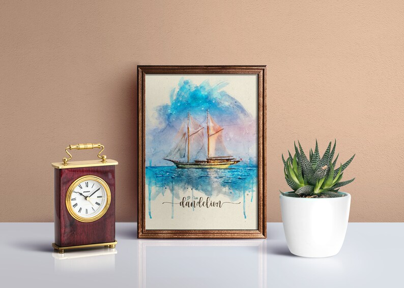 May include: A watercolour painting of a sailboat on the ocean with a blue and pink sky. The painting is framed in a brown frame and has the word "dandelion" written below the image.