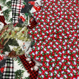 May include: A red and white patchwork quilt with a circular design in the center. The center circle features a green and brown forest scene. The outer edges of the quilt are made up of various red and white plaid fabrics.