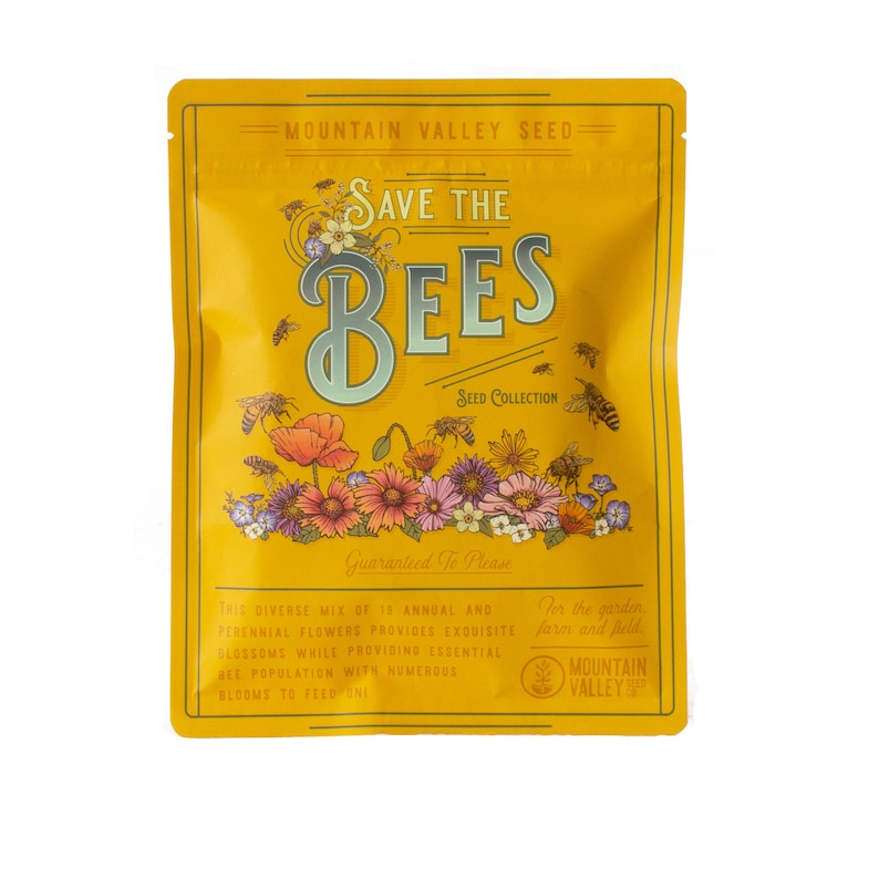 May include: A yellow pouch with the text "Save the Bees" in a vintage style font. The pouch contains a seed collection for planting flowers that attract bees. The text "Guaranteed to Please" is printed on the pouch. The pouch is labeled "Mountain Valley Seed".
