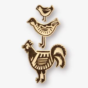 May include: Three wooden cutouts of birds, a rooster, a small bird, and a slightly larger bird. The rooster is at the bottom, the small bird is on top of the larger bird, and the larger bird is on top of the rooster.