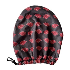 May include: A black satin hair bonnet with a red cloud pattern. The bonnet has a drawstring closure.