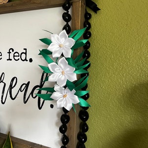 Lei aux noix de kukui et aux plumerias