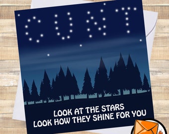 May include: A greeting card with a dark blue background and white stars forming the word "CUNT" in the sky. The card has a forest silhouette at the bottom with the text "LOOK AT THE STARS LOOK HOW THEY SHINE FOR YOU".