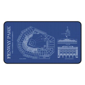 May include: A blue and white blueprint-style mousepad featuring a detailed diagram of Fenway Park, including the stadium's layout, dimensions, and architectural details. The text "Fenway Park" and "The Cathedral of Baseball" are printed on the left side.