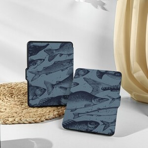 May include: Two blue and black e-reader cases with a fish pattern. The cases are made of a soft, durable material and have a sleek, modern design.