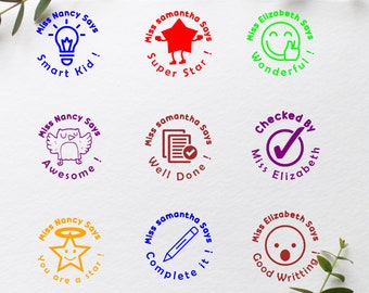 May include: Nine colourful round teacher stamps with different messages and images. The stamps say "Miss Nancy Says", "Miss Samantha Says", and "Miss Elizabeth Says". The images include a lightbulb, a star, a smiley face, an owl, a tick, a pencil, and a star with a smiley face.
