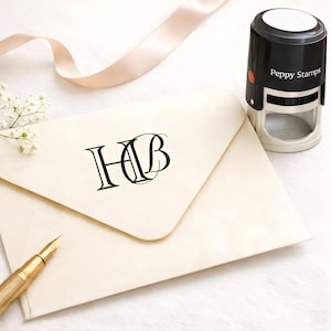May include: A set of three ceramic mugs with a speckled, matte finish. The mugs are in shades of cream, light gray, and dark gray. Each mug has a simple, minimalist design and a rounded handle.