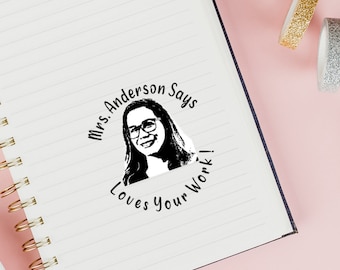 May include: Black and white teacher stamp with a photo of a woman and the text "Mrs. Anderson Says Loves Your Work!"