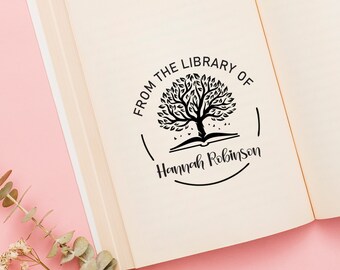 May include: A black and white stamp with a tree growing out of an open book. The text reads "From the Library of Hannah Robinson".