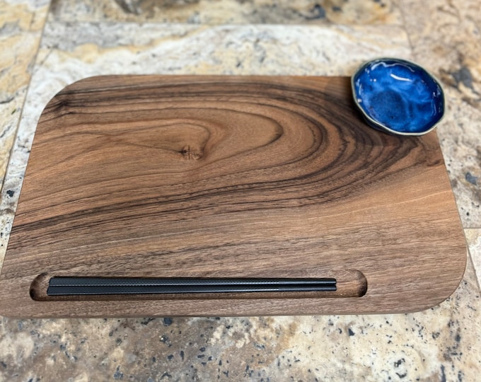 Sushi boards with chopsticks & sauce bowl