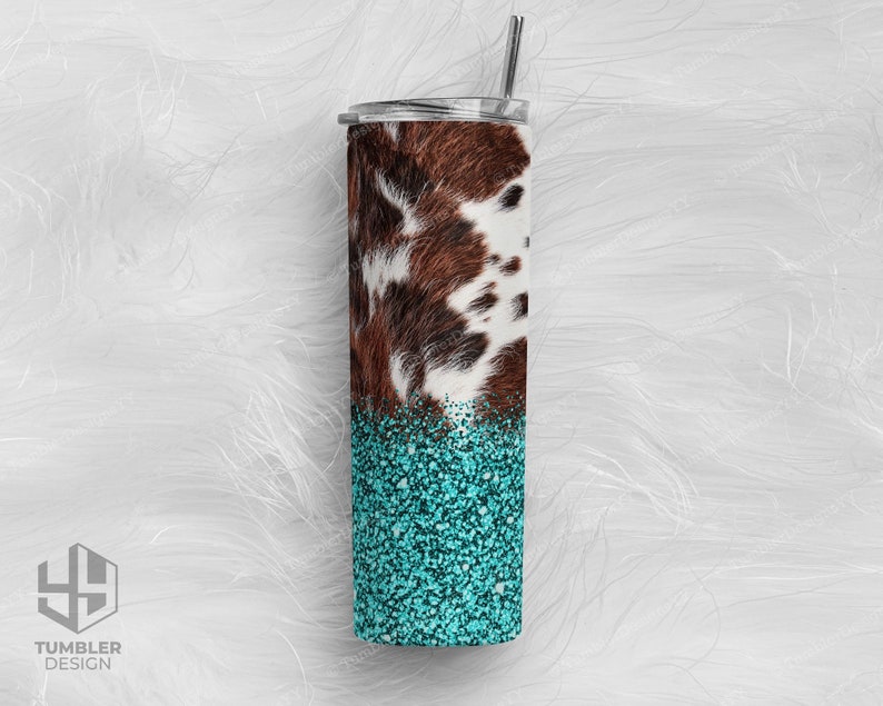 May include: A stainless steel tumbler with a cowhide pattern and turquoise glitter bottom. The tumbler has a silver lid and a silver straw. The words "Tumbler Design" are printed on the bottom left.