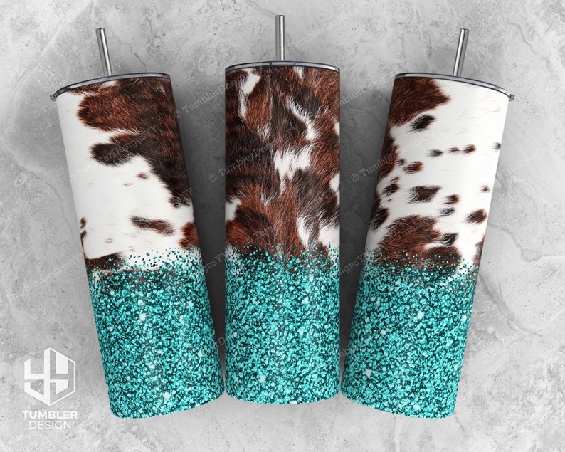 May include: Three stainless steel tumblers with a cowhide pattern and turquoise glitter bottoms. Each tumbler has a silver straw and a black lid. The cowhide design features brown and white patches.