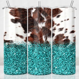 May include: Three stainless steel tumblers with a cowhide pattern and turquoise glitter base. The cowhide design features brown and white patches. Each tumbler has a silver straw and lid.