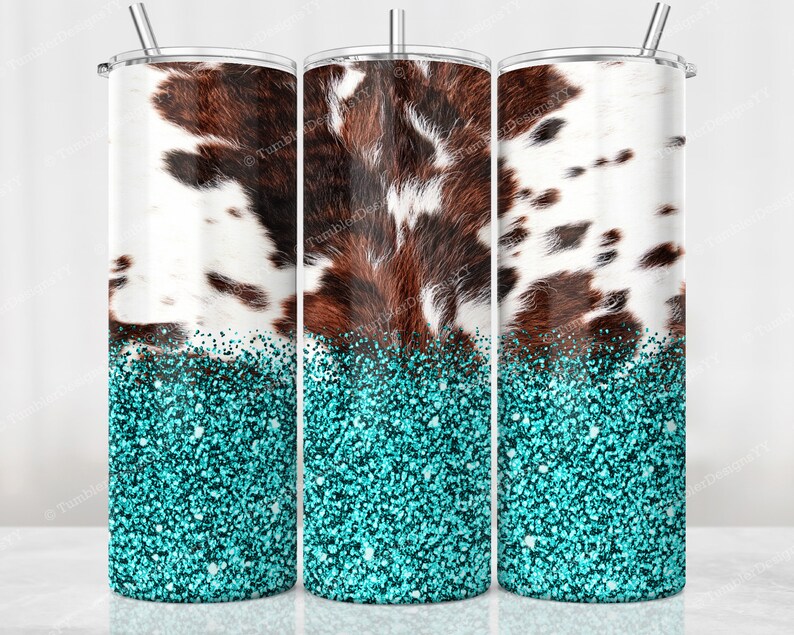May include: Three stainless steel tumblers with a cowhide pattern and turquoise glitter base. The cowhide design features brown and white patches. Each tumbler has a silver straw and lid.