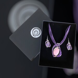 Oval shaped purple and pink pendant necklace with matching earrings