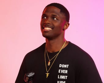 Don't Ever Limit Kids (front) Delk Develops logo (back) Unisex Tee T-shirt