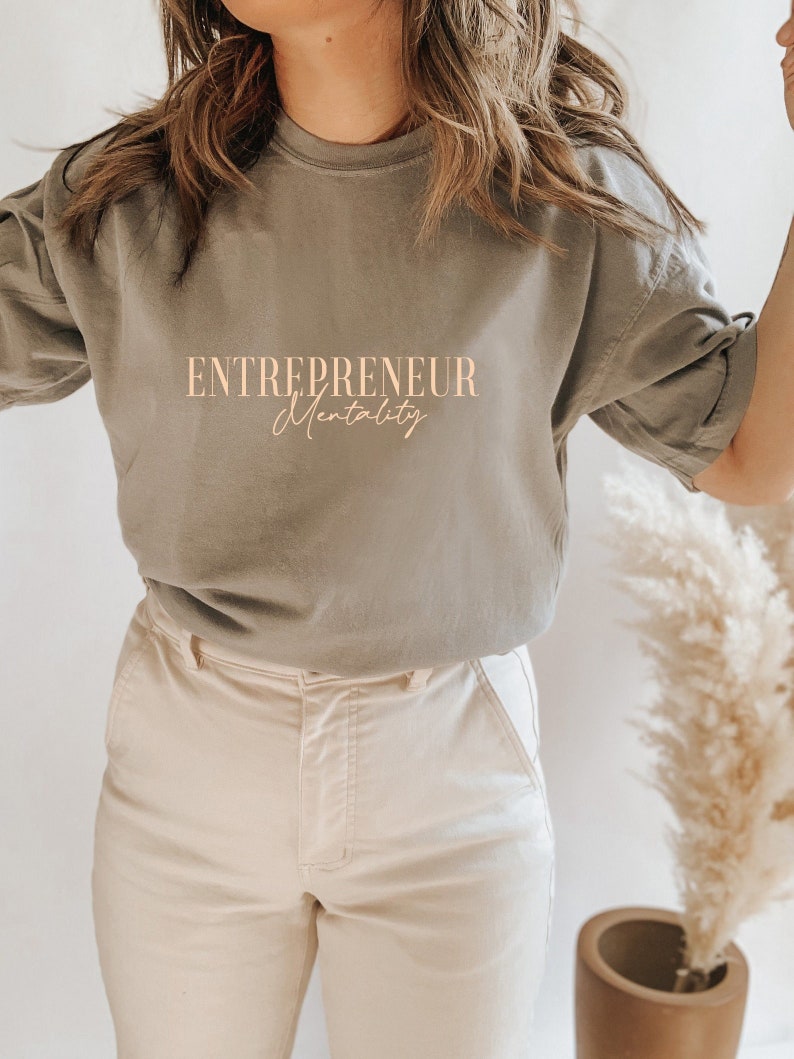 May include: A gray t-shirt with the text "ENTREPRENEUR Mentality" printed on the front.