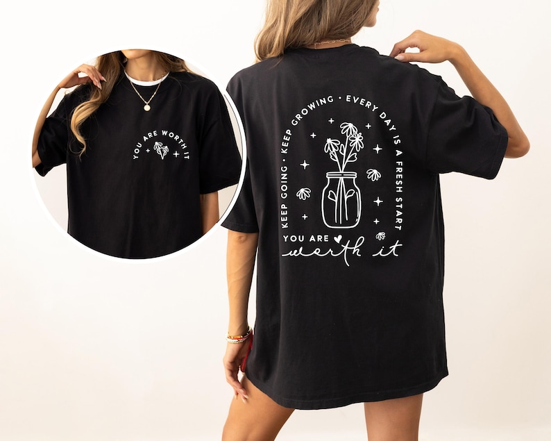 May include: Black oversized t-shirt with a white graphic print of a mason jar with flowers and the text "Keep going. Keep growing. Every day is a fresh start. You are worth it."