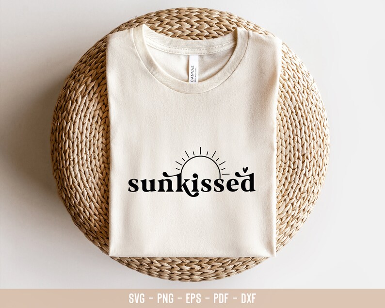 May include: A white t-shirt with the text "sunkissed" in black lettering. The text is stylized with a sun graphic above it.