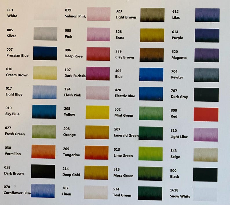 May include: A colour reference chart featuring a grid of numbered thread swatches. Each entry displays a unique numerical code, a colour name, and a corresponding rectangular sample of thread colour, ranging from white and silver to various blues, greens, and reds.