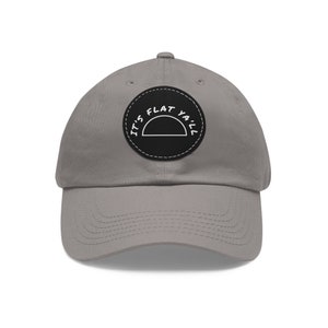 May include: A gray baseball cap with a black patch that says "It's Flat Ya'll" in white text.