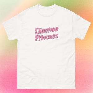 May include: White t-shirt with pink text that reads "Diarrhea Princess".