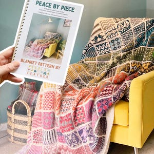 May include: A vibrant patchwork blanket in shades of pink, orange, purple, and blue, draped over a yellow armchair. The blanket features geometric patterns. A book titled "Peace by Piece" is held in the foreground.