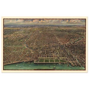 May include: An aerial view of Chicago, a vintage map print. The map shows the city's layout with streets, buildings, and the lakefront. The print has a cream-colored border and a title at the bottom.