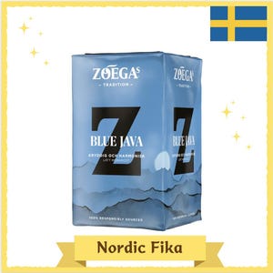 May include: A blue package of Zoegas Blue Java coffee. The package features the text "Blue Java" in large black letters, with additional text in Swedish. The words "Nordic Fika" are at the bottom.