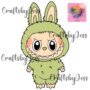 May include: A green cartoon monster wearing a fuzzy costume with bunny ears and a toothy grin. The monster has large black eyes and rosy cheeks.
