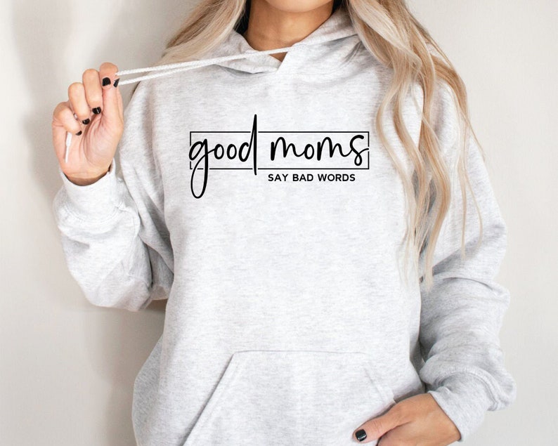 May include: Gray hooded sweatshirt with the text "good moms say bad words" printed on the front.