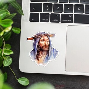 May include: A watercolor painting of a man with a crown of thorns on his head. He is wearing a blue robe and has a sad expression on his face.