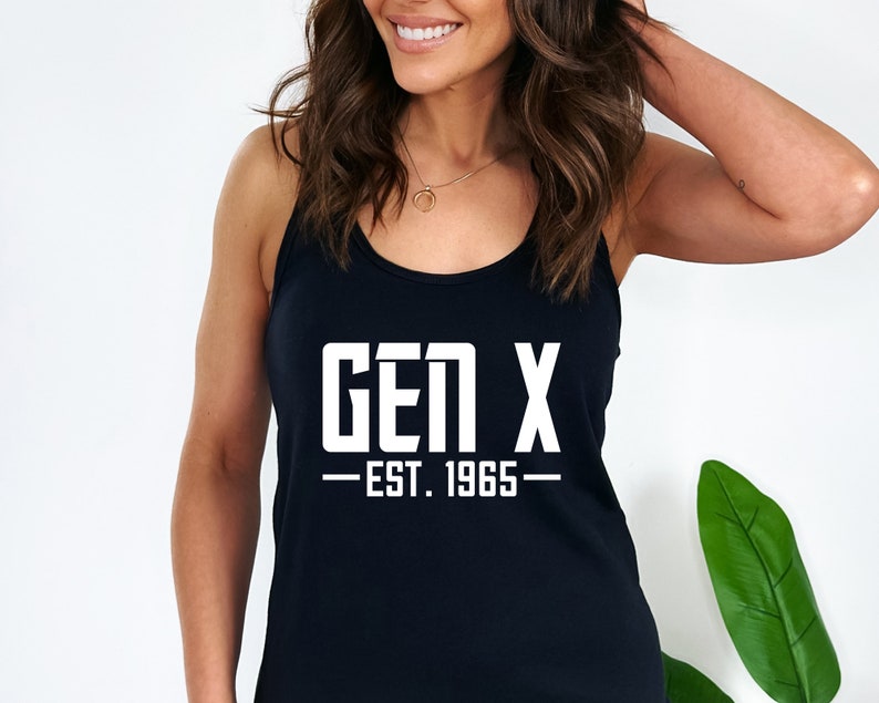 May include: Black tank top with white text that reads "GEN X - EST. 1965 -"