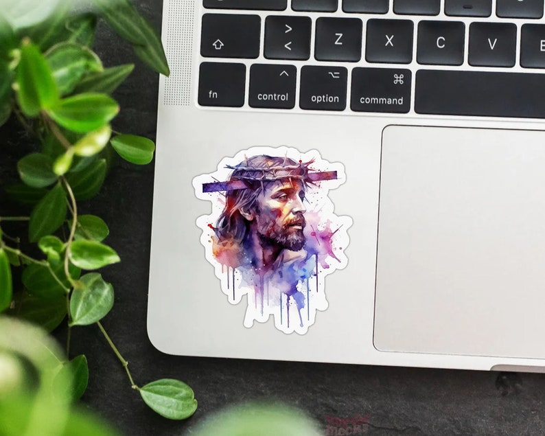 May include: A watercolor painting of Jesus Christ with a crown of thorns. The painting is in shades of purple, blue, and pink.