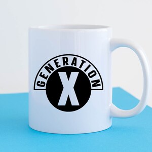 May include: White ceramic mug with a black graphic of a circle with the text "GENERATION X" and a black letter "X" inside the circle.
