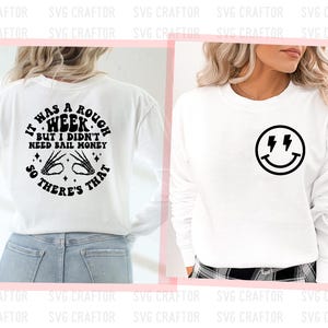 May include: White long-sleeve shirt with a black graphic on the back that says "It was a rough week, but I didn't need bail money, so there's that." The front of the shirt has a black smiley face with lightning bolts for eyes.