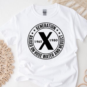 May include: White t-shirt with a black circle graphic that says "Generation X Raised on Hose Water and Neglect 1965-1980".