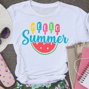 May include: White t-shirt with a watermelon graphic and the text "HELLO Summer" with colourful popsicle graphics.